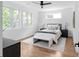 Bright bedroom with hardwood floors, a ceiling fan, three large windows and neutral decor creates a calm, inviting space at 88 Cleveland Unit B Se St, Atlanta, GA 30316