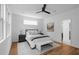 This bedroom features hardwood floors, a ceiling fan and a large window providing ample natural light at 88 Cleveland Unit B Se St, Atlanta, GA 30316
