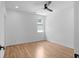 A light-filled bedroom with a ceiling fan and hardwood floors at 88 Cleveland Unit B Se St, Atlanta, GA 30316