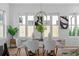 Bright dining room with hardwood floors, modern lighting fixture, and six chairs surrounding the table at 88 Cleveland Unit B Se St, Atlanta, GA 30316