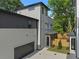 Side view of the modern home featuring an attached garage and neutral-colored siding at 88 Cleveland Unit B Se St, Atlanta, GA 30316