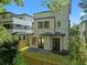 Back exterior view of this home with a modern fence and lush trees around at 88 Cleveland Unit B Se St, Atlanta, GA 30316