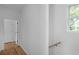Bright hallway featuring hardwood floors, white walls, and a window at 88 Cleveland Unit B Se St, Atlanta, GA 30316