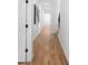 Long hallway features hardwood floors, recessed lighting, and a modern painting, creating a bright and spacious feel at 88 Cleveland Unit B Se St, Atlanta, GA 30316