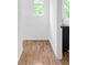 Hallway features hardwood floors, natural light and white walls for a clean and inviting aesthetic at 88 Cleveland Unit B Se St, Atlanta, GA 30316