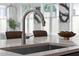 Close-up of kitchen island sink with modern faucet, and bright light from large windows at 88 Cleveland Unit B Se St, Atlanta, GA 30316