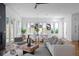 Open-concept living and dining area with modern lighting, fireplace, and stylish furnishings at 88 Cleveland Unit B Se St, Atlanta, GA 30316