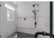 This modern shower features a rainfall shower head, built-in shelves, and a window that provides natural light at 88 Cleveland Unit B Se St, Atlanta, GA 30316
