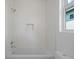 Clean bathroom featuring a shower-tub combo, and shower niche at 88 Cleveland Unit B Se St, Atlanta, GA 30316
