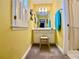 Bright bathroom featuring vanity, mirror, and natural light from the window at 1093 Spruce Creek Ln, Lawrenceville, GA 30045
