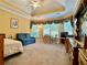 Spacious bedroom with ample natural light, carpet, and room for a sitting area at 1093 Spruce Creek Ln, Lawrenceville, GA 30045