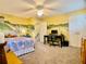 Bedroom with custom whimsical mural, workspace, and closet space at 1093 Spruce Creek Ln, Lawrenceville, GA 30045