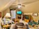 Open bonus room with a seating area, entertainment center, tv and lots of space at 1093 Spruce Creek Ln, Lawrenceville, GA 30045