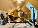 Bonus room featuring exercise equipment, seating area, mounted TV and lots of space at 1093 Spruce Creek Ln, Lawrenceville, GA 30045