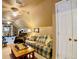 Bonus room features seating, carpet, and weight lifting area at 1093 Spruce Creek Ln, Lawrenceville, GA 30045