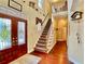 Inviting foyer with hardwood floors, a staircase, and a decorative glass front door at 1093 Spruce Creek Ln, Lawrenceville, GA 30045