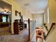 Hallway with built-in shelving, view of dining room below and a view into the bedroom at 1093 Spruce Creek Ln, Lawrenceville, GA 30045