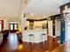 Open kitchen view with an island, barstool seating, and hardwood floors, connected to the living area at 1093 Spruce Creek Ln, Lawrenceville, GA 30045