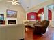 Spacious living room featuring vaulted ceilings, hardwood floors, a fireplace, and an open layout at 1093 Spruce Creek Ln, Lawrenceville, GA 30045