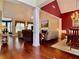 Open-concept living room and dining room with hardwood floors and neutral decor at 1093 Spruce Creek Ln, Lawrenceville, GA 30045