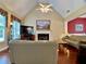 Bright living room featuring hardwood floors, a fireplace, and neutral decor at 1093 Spruce Creek Ln, Lawrenceville, GA 30045