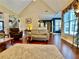 Well-lit living room boasting hardwood floors, a cozy rug, and access to other areas of the home at 1093 Spruce Creek Ln, Lawrenceville, GA 30045