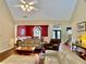 Open-concept living room and dining room with hardwood floors and neutral decor at 1093 Spruce Creek Ln, Lawrenceville, GA 30045