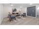 Cozy basement living room with a textured accent wall and comfortable seating at 176 Rhodesia Se Ave, Atlanta, GA 30315