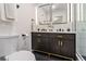 Modern bathroom featuring a dual vanity, sleek mirrors, and updated fixtures at 176 Rhodesia Se Ave, Atlanta, GA 30315