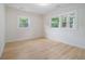 Bright bedroom with natural light, hardwood floors, and neutral decor at 176 Rhodesia Se Ave, Atlanta, GA 30315