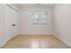 Bright bedroom with hardwood floors and a closet at 176 Rhodesia Se Ave, Atlanta, GA 30315