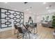 Open-concept dining area featuring hardwood floors, modern lighting, and stylish decor at 176 Rhodesia Se Ave, Atlanta, GA 30315