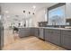 Modern kitchen with stainless steel appliances, gray cabinets, and an open layout at 176 Rhodesia Se Ave, Atlanta, GA 30315