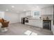 Bright kitchenette featuring white cabinets, butcher block counters, and stainless appliances at 176 Rhodesia Se Ave, Atlanta, GA 30315