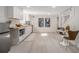 Open kitchenette featuring white cabinets, butcher block counters, and stainless appliances at 176 Rhodesia Se Ave, Atlanta, GA 30315