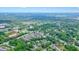 Panoramic aerial view featuring residential neighborhoods and commercial buildings amidst lush greenery at 3689 Spring Hill Se Rd, Smyrna, GA 30080