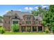 Stunning brick home with a spacious deck overlooking the well-maintained yard and walk out basement at 3689 Spring Hill Se Rd, Smyrna, GA 30080