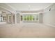 Expansive basement space with a large window and neutral carpet perfect for entertaining or recreation at 3689 Spring Hill Se Rd, Smyrna, GA 30080