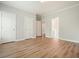Spacious bedroom features wood floors, plenty of natural light, and neutral paint at 3689 Spring Hill Se Rd, Smyrna, GA 30080