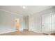 Bright bedroom shows entrances to the bathroom and closets, plus stylish, modern flooring at 3689 Spring Hill Se Rd, Smyrna, GA 30080