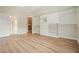 Spacious bedroom with hardwood floors, white built-in shelving, and easy access to the kitchen and closet at 3689 Spring Hill Se Rd, Smyrna, GA 30080