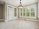 Bright breakfast nook with large windows and white tile flooring offers sun-drenched views at 3689 Spring Hill Se Rd, Smyrna, GA 30080