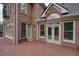 Spacious deck with access to the brick house, several windows, and wooded view at 3689 Spring Hill Se Rd, Smyrna, GA 30080