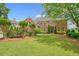 Brick home with well-manicured lawn and mature landscaping in a lovely neighborhood at 3689 Spring Hill Se Rd, Smyrna, GA 30080
