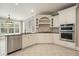Kitchen features stainless appliances, custom cabinets, granite countertops, and breakfast nook at 3689 Spring Hill Se Rd, Smyrna, GA 30080