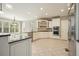 Eat-in kitchen features custom white cabinets, granite countertops, and stainless steel appliances at 3689 Spring Hill Se Rd, Smyrna, GA 30080
