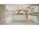 Open kitchen design with island, white cabinetry, stainless steel appliances, and breakfast nook at 3689 Spring Hill Se Rd, Smyrna, GA 30080