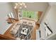 Living room boasts a large bay window and a chandelier, filling the space with natural light at 3689 Spring Hill Se Rd, Smyrna, GA 30080