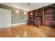 Spacious office featuring custom built-in bookshelves and hardwood floors at 3689 Spring Hill Se Rd, Smyrna, GA 30080
