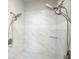 Spa-like shower featuring dual shower heads, and marble tiled walls at 3689 Spring Hill Se Rd, Smyrna, GA 30080